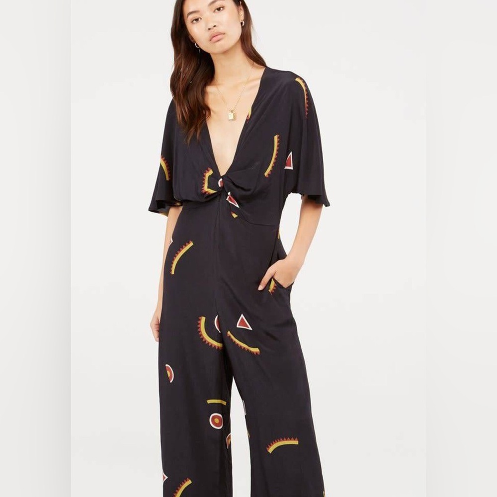 Capulet Black Jumpsuit with Red and Yellow Accents